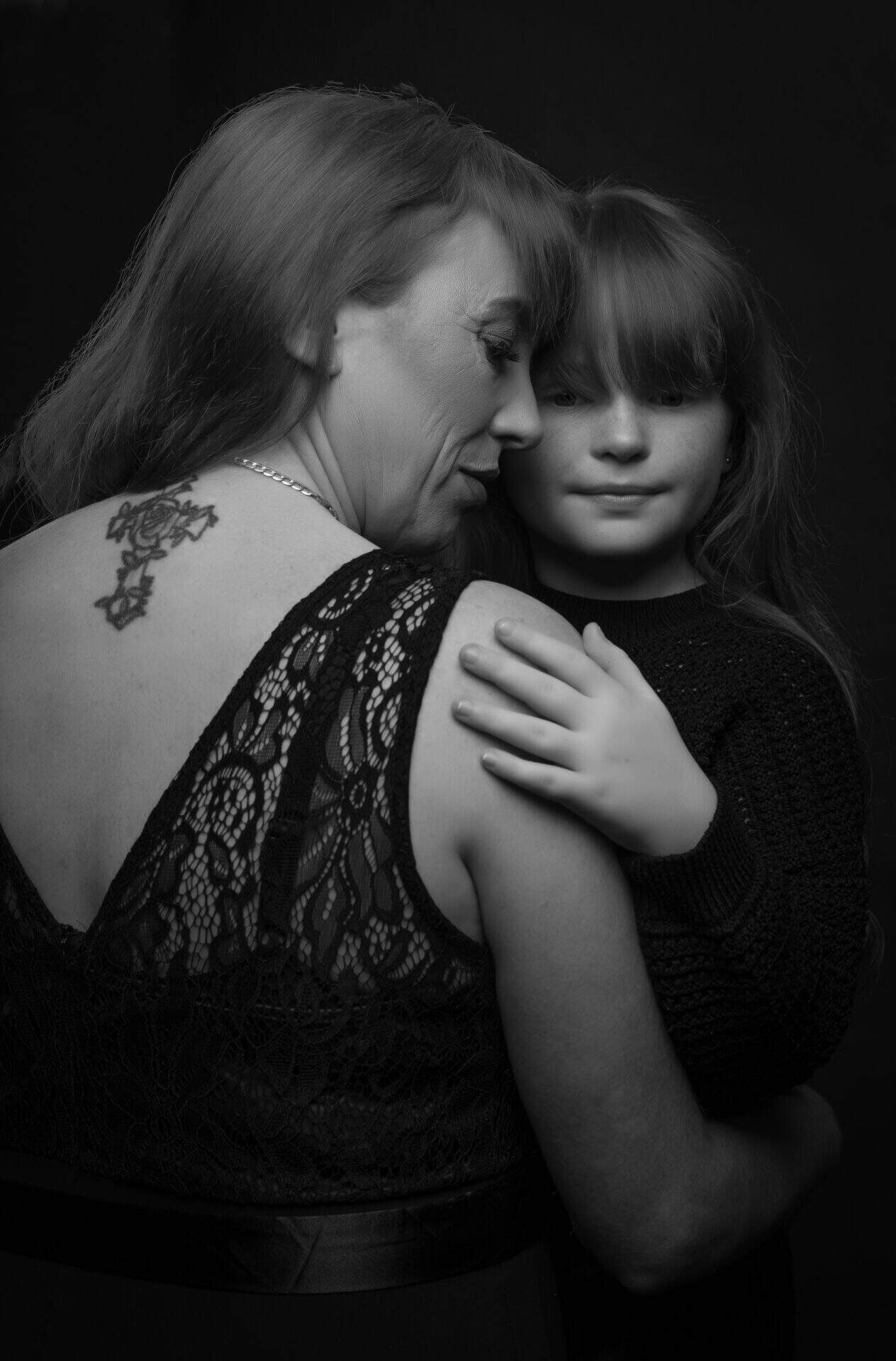 black and white studio photography with mother and daughter